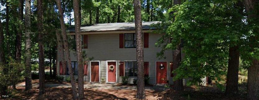 a view of a house with a tree