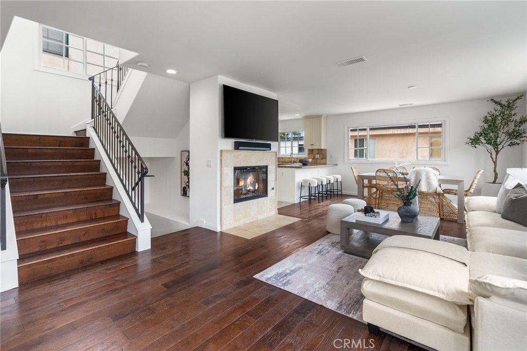 a living room with fireplace furniture and a flat screen tv