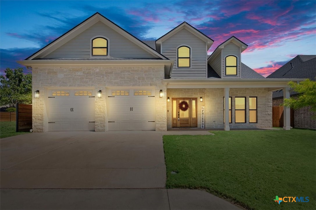 a front view of a house with a yard