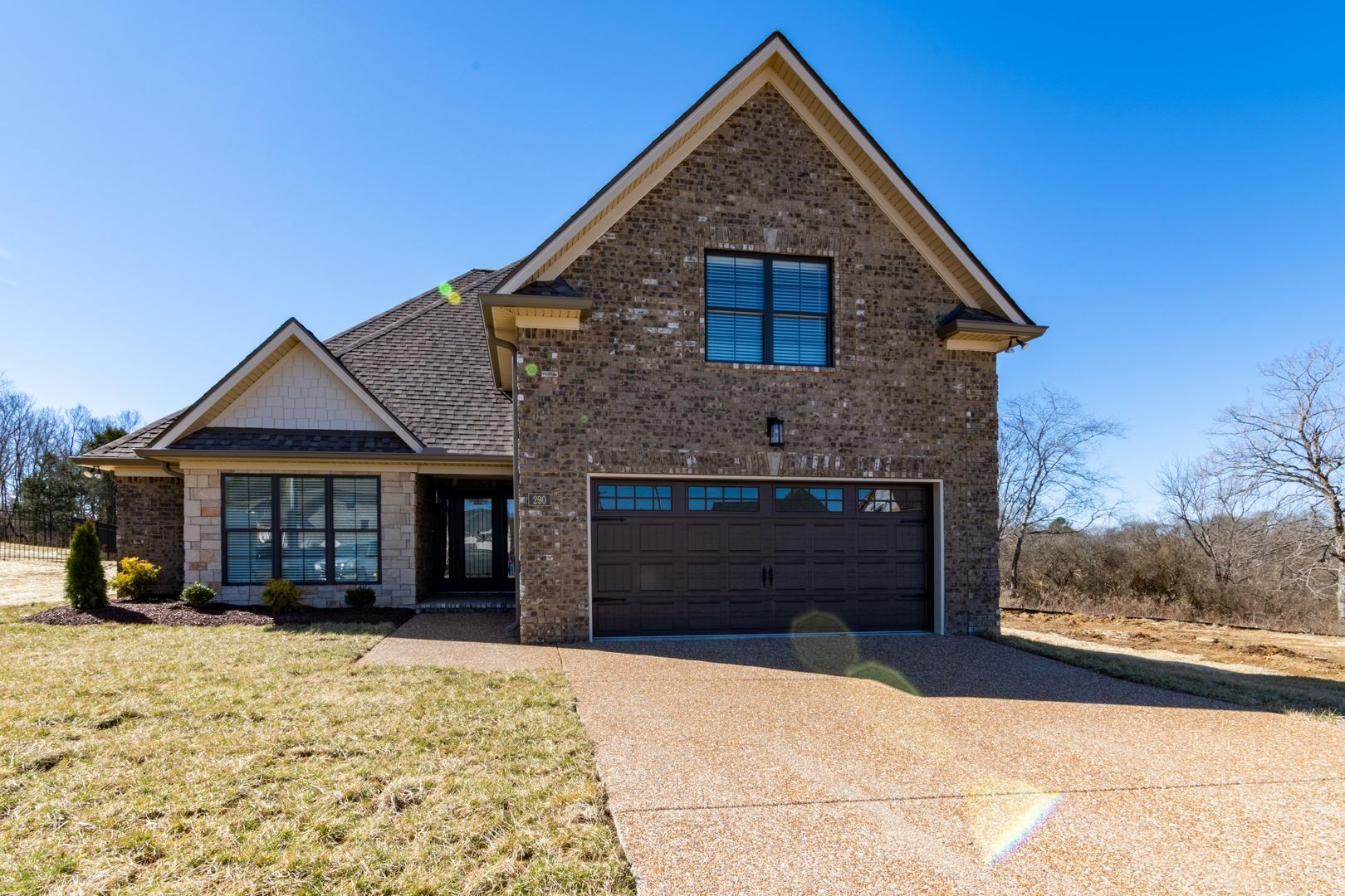 a front view of a house with a yard