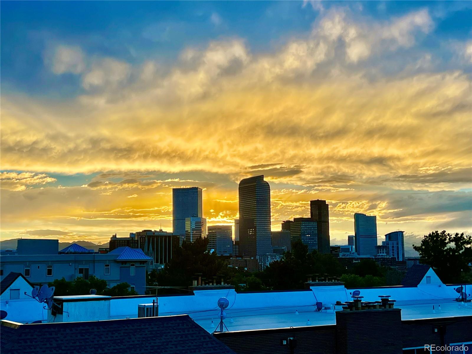 a view of a city with lawn chairs and a view of city