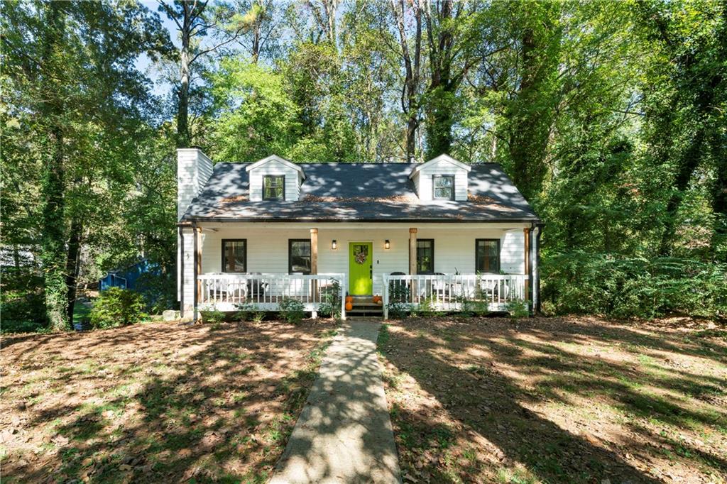 a front view of house with outdoor seating