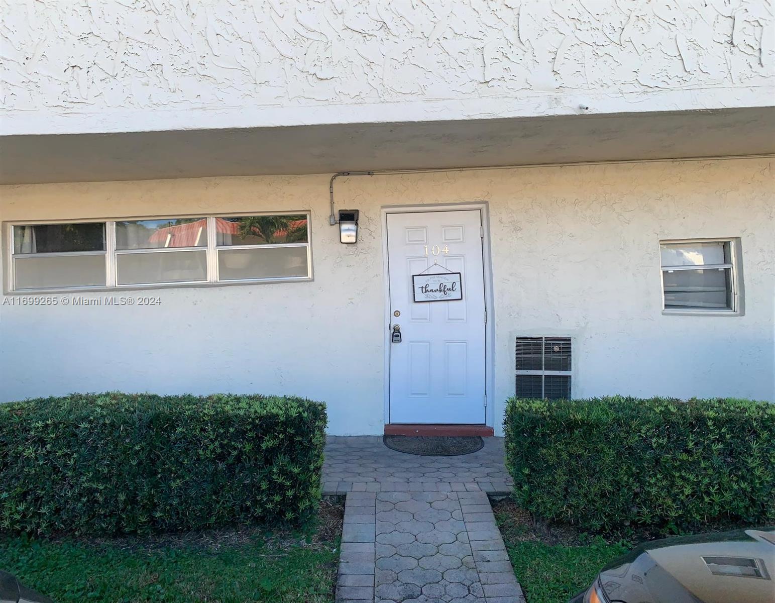 a view of house with backyard