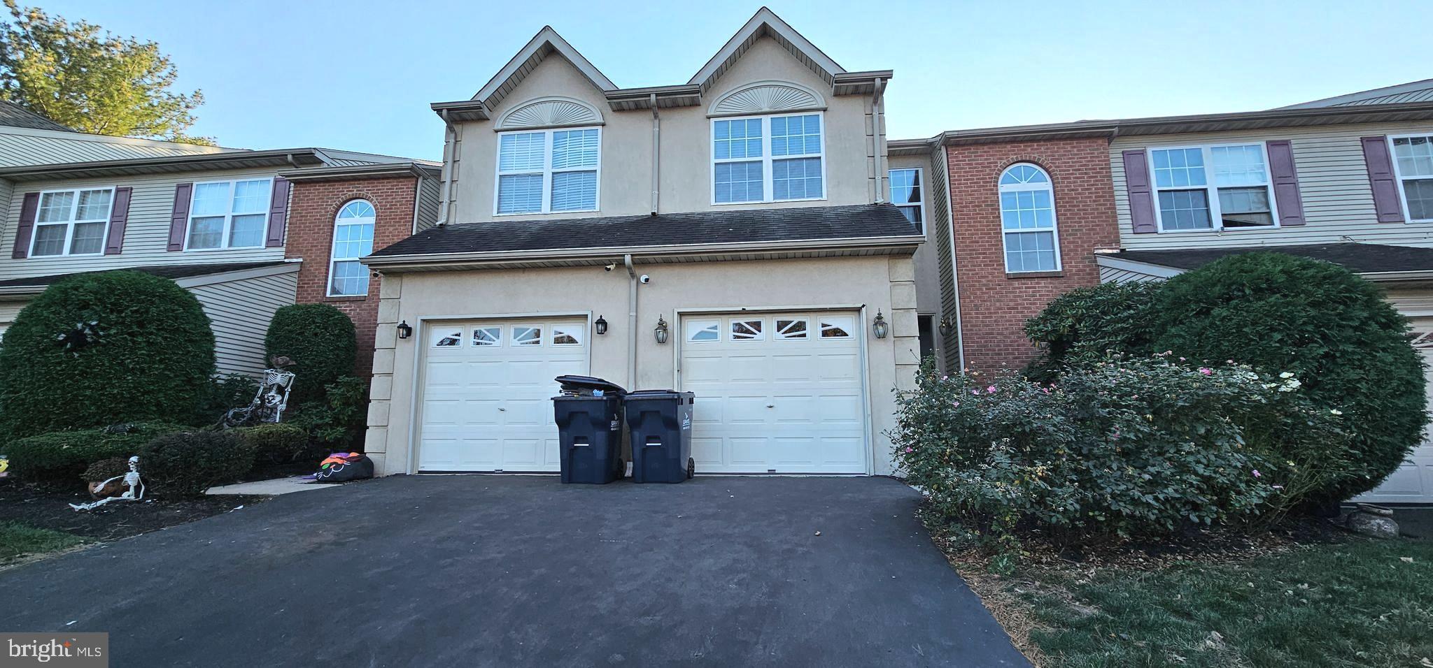 a view of a house with brick walls and a yard