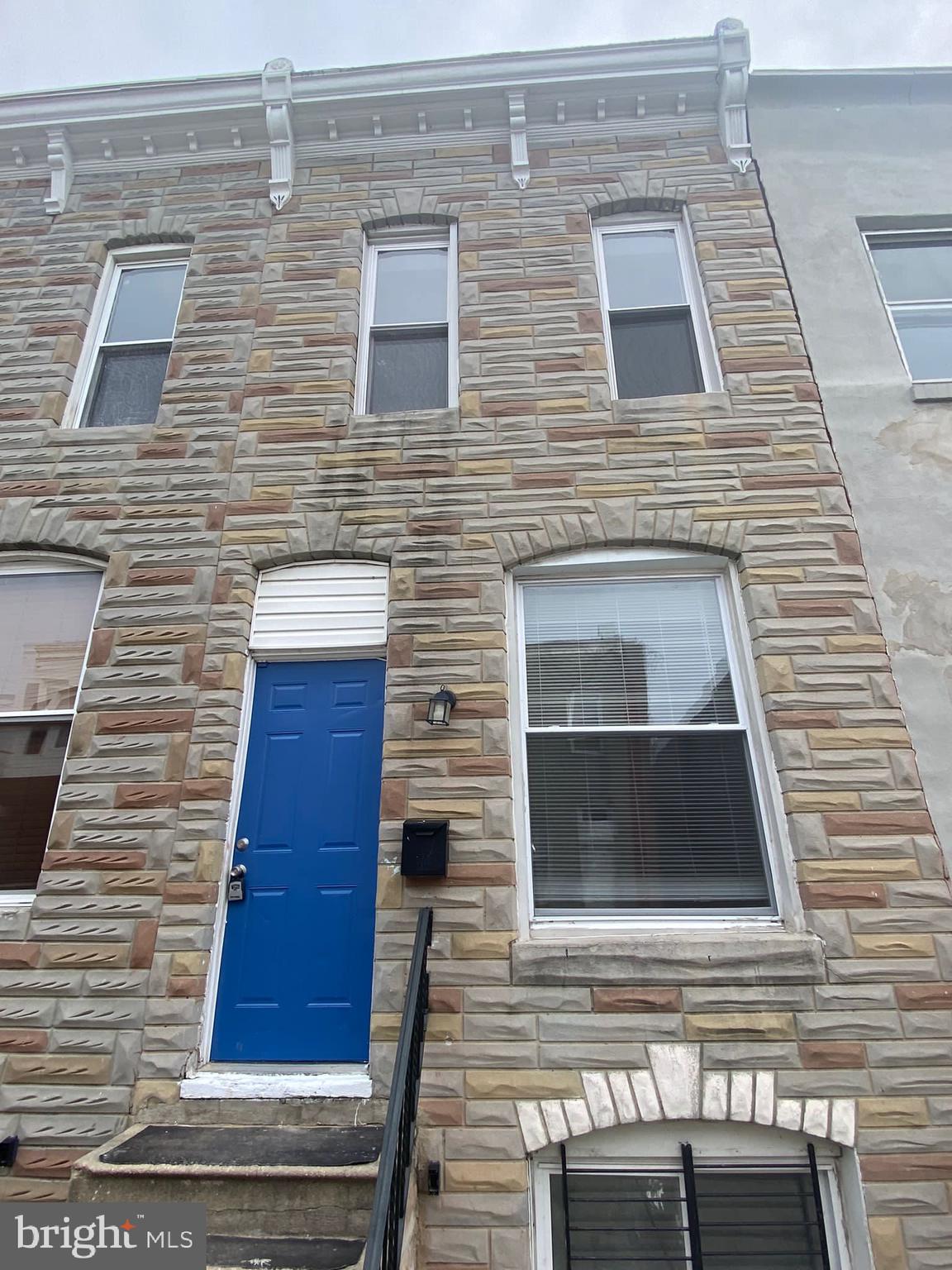 a brick house with a large door