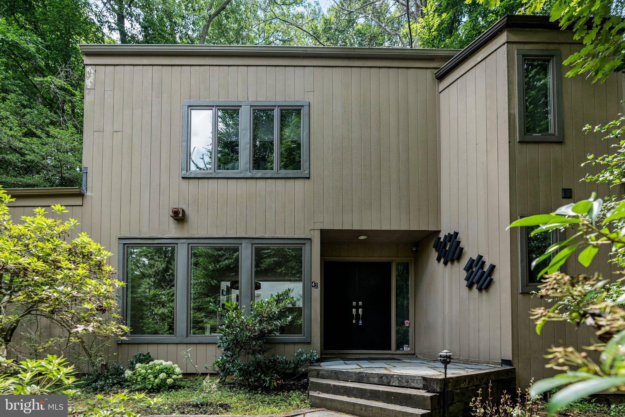 a view of house with yard