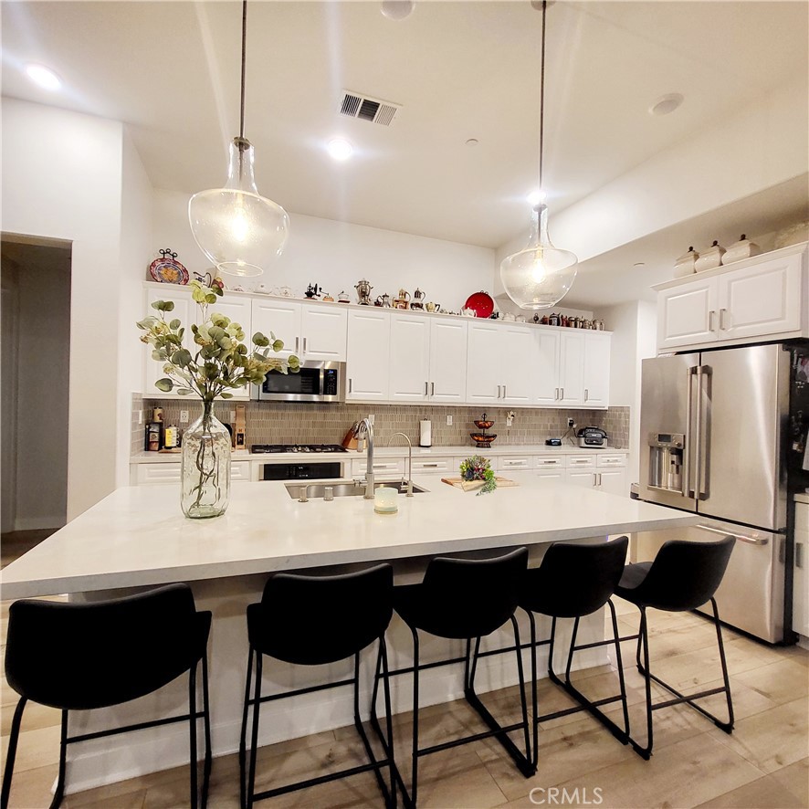 a kitchen with a dining table and chairs