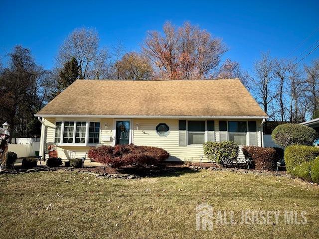 a front view of a house with a yard and outdoor seating