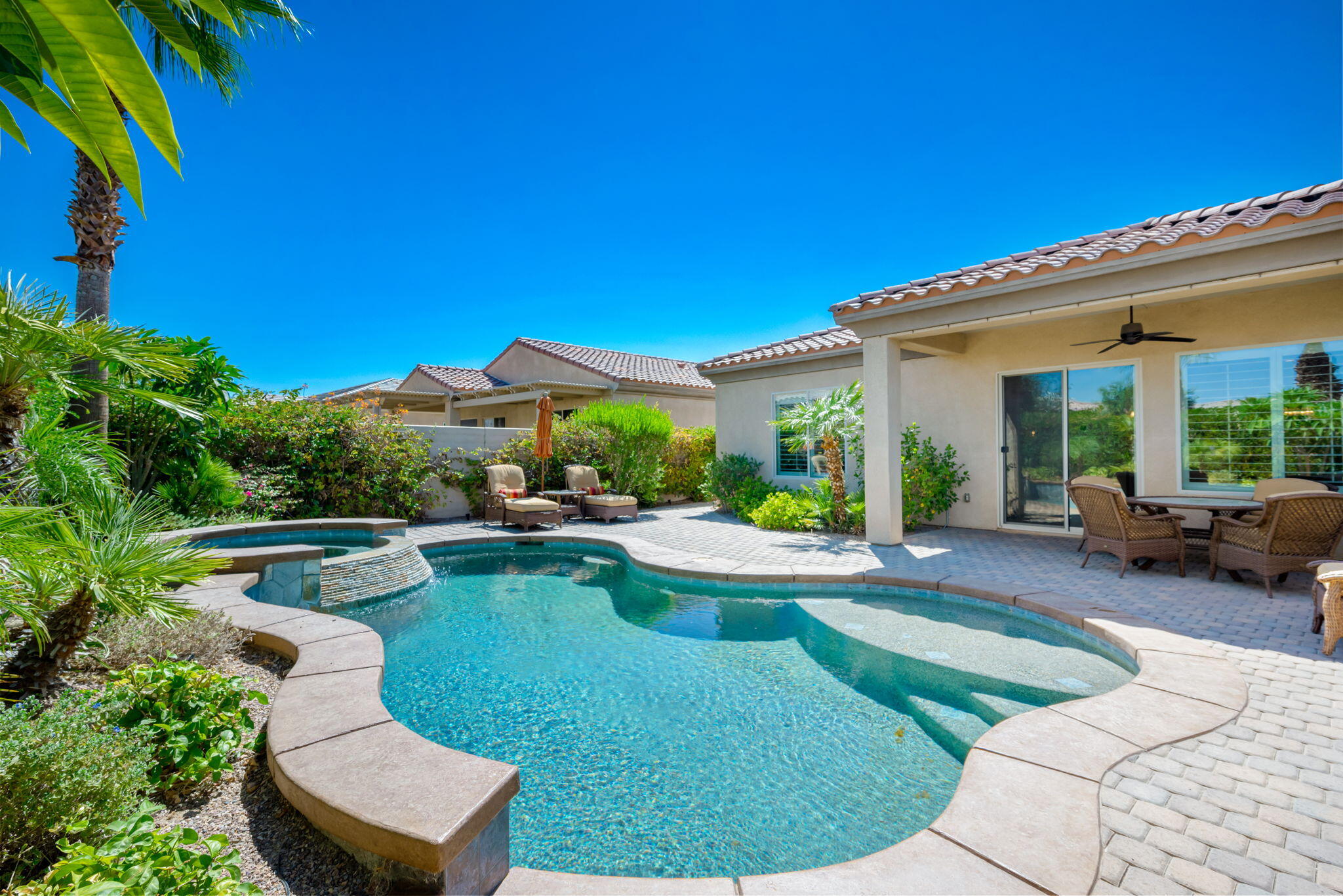 a view of swimming pool and lounge chair