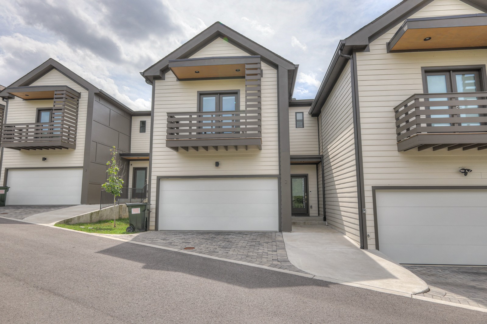 a front view of a house with a garage