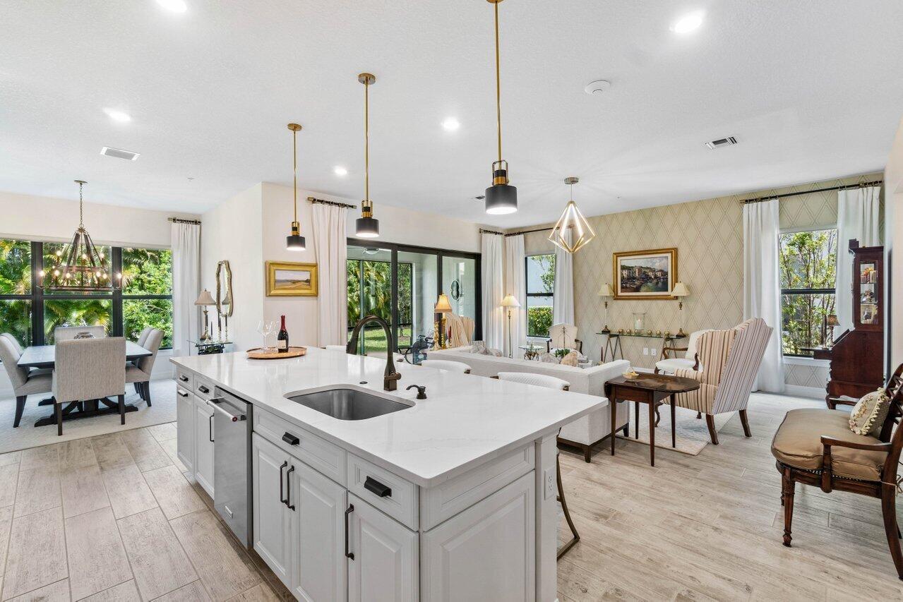 a large white kitchen with a large window