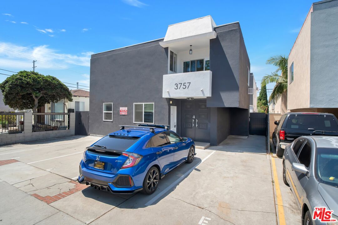 a car parked in front of a building