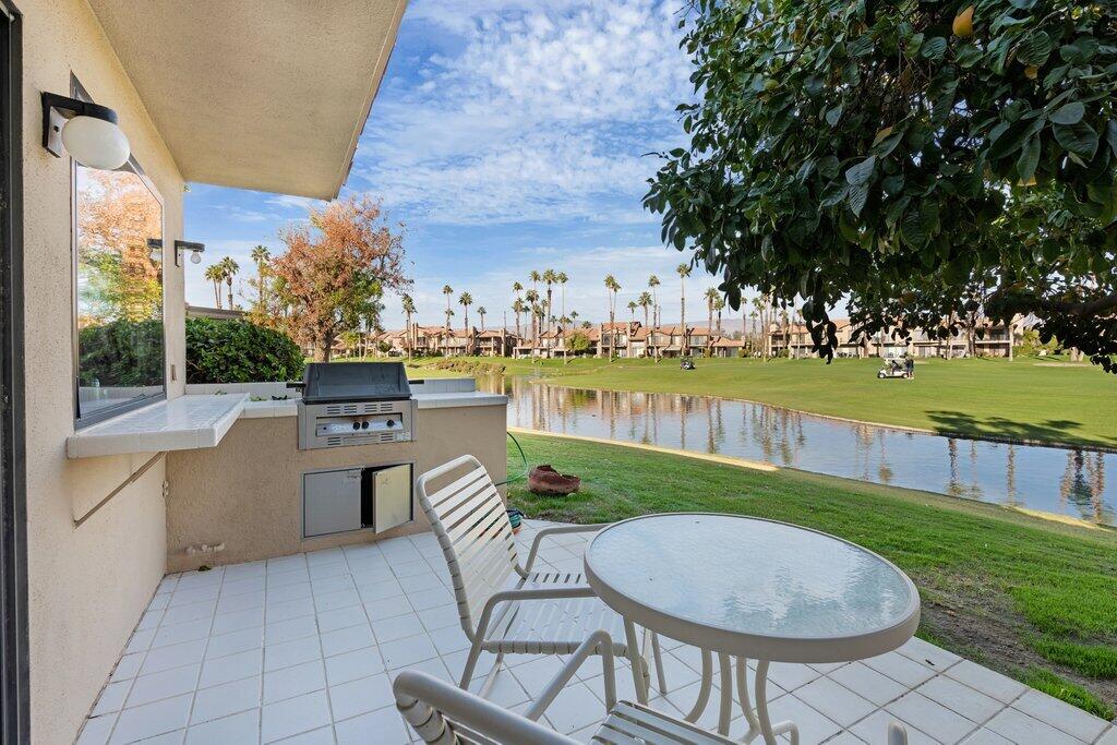 a view of a swimming pool and lounge chairs