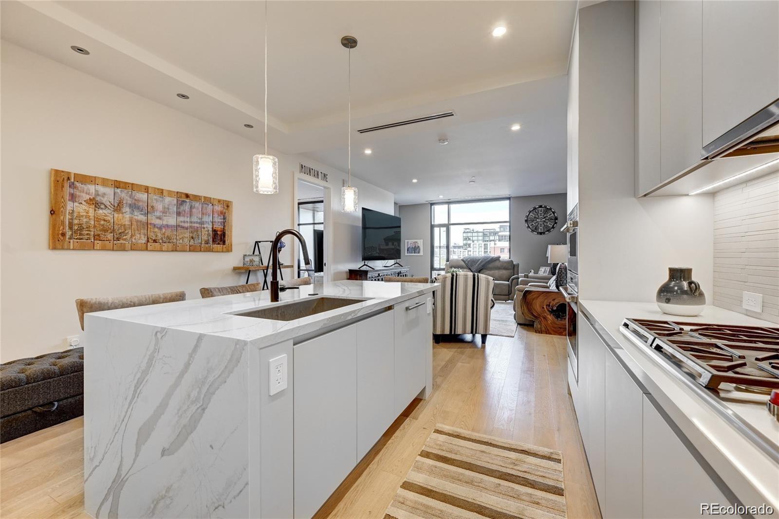 a kitchen with counter top space a sink and appliances