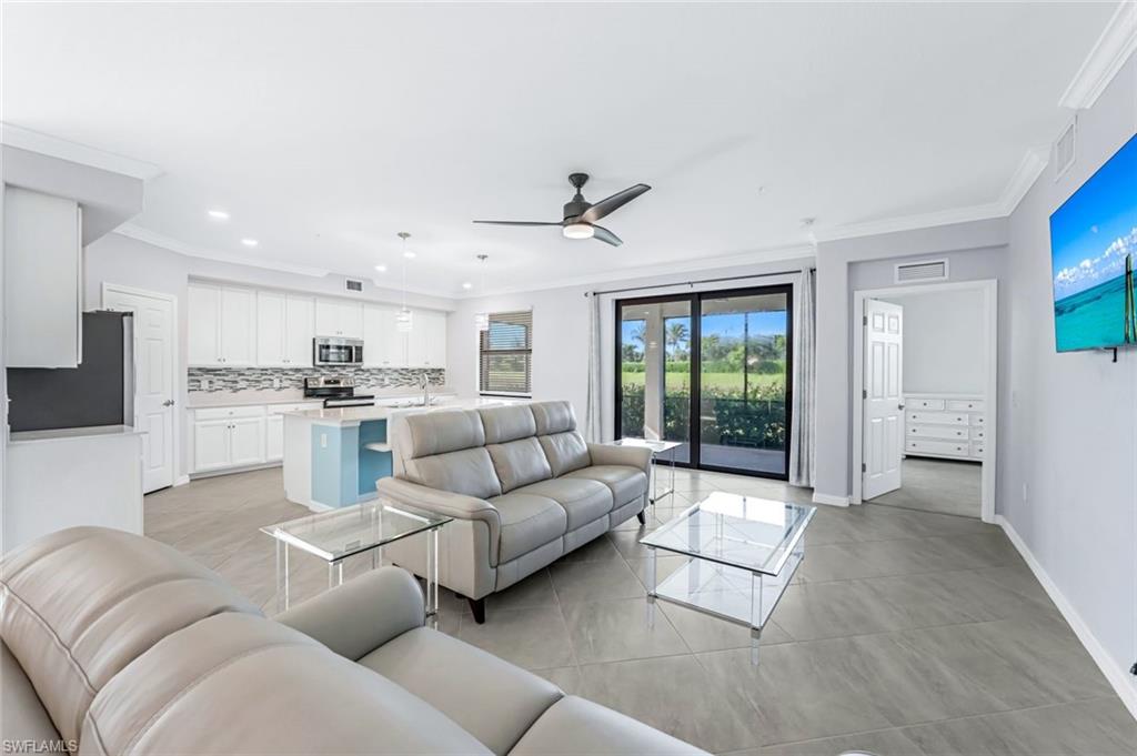 a living room with furniture white walls and white walls