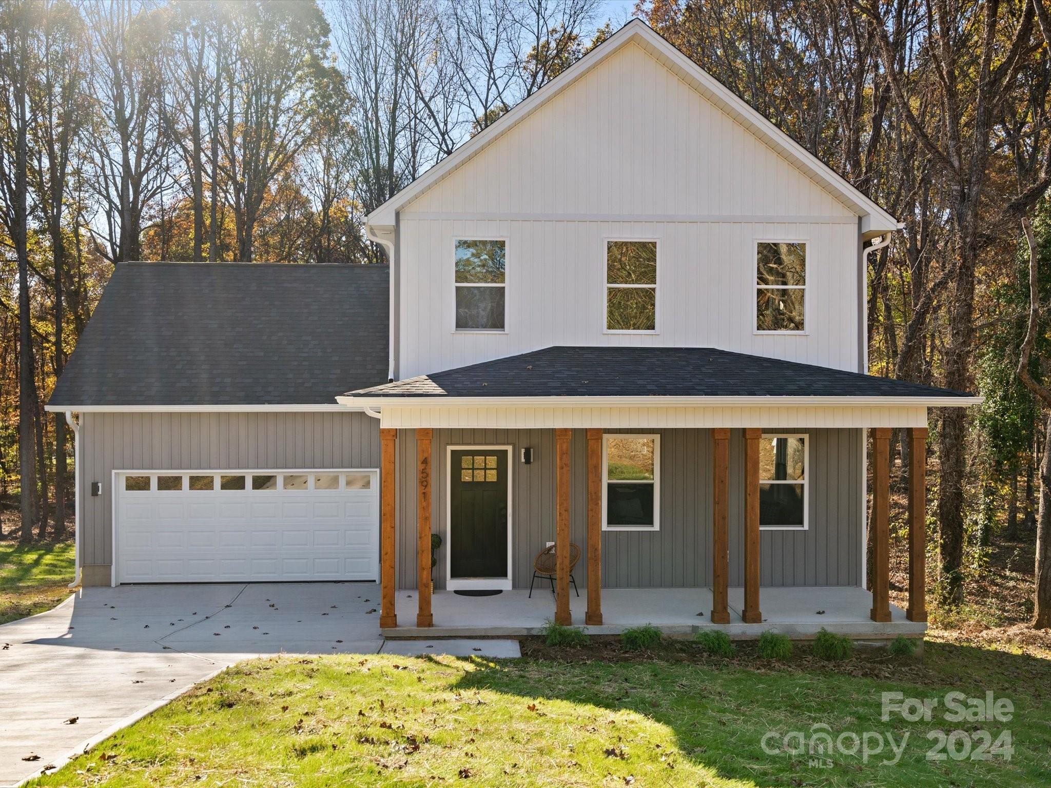 a view of house with yard