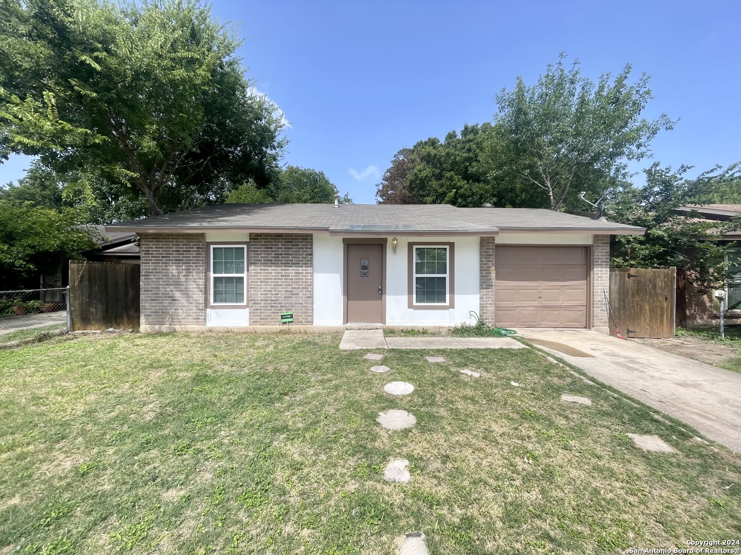 front view of a house with a yard