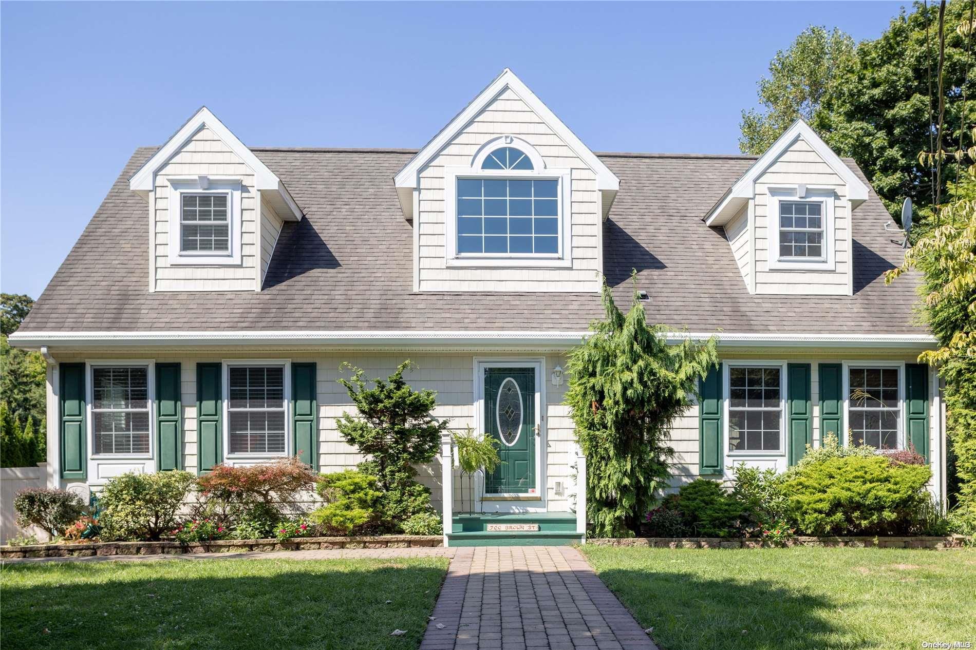 front view of a house and a yard