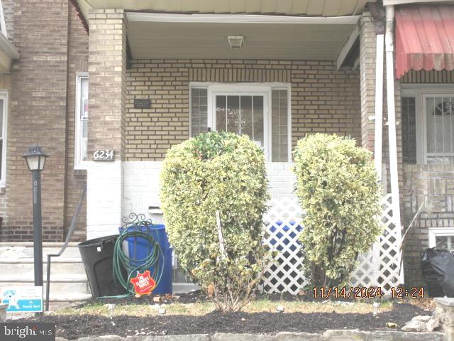 a view of a door and a window