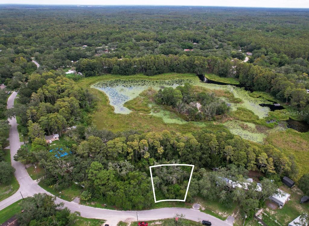 an aerial view of residential house with outdoor space