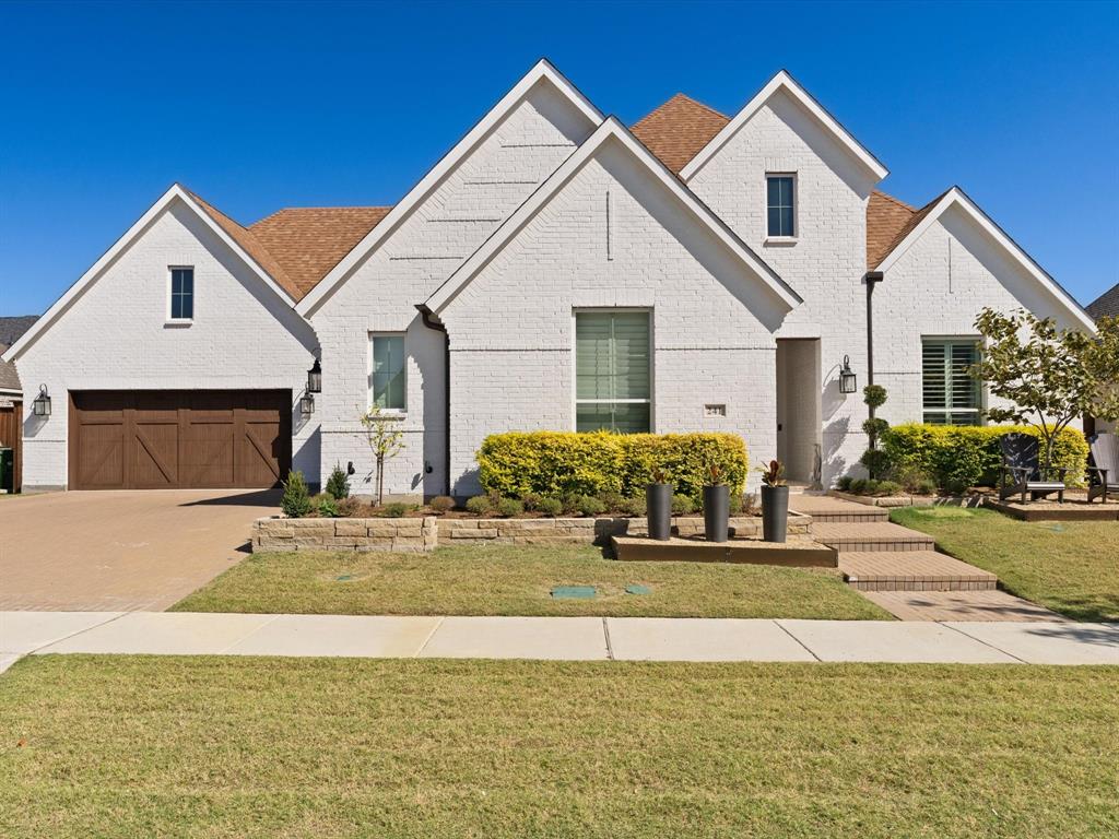 a view of a house with patio and yard