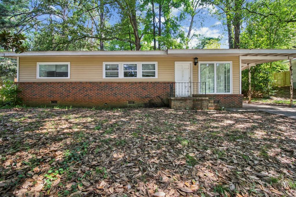 front view of a house with a yard