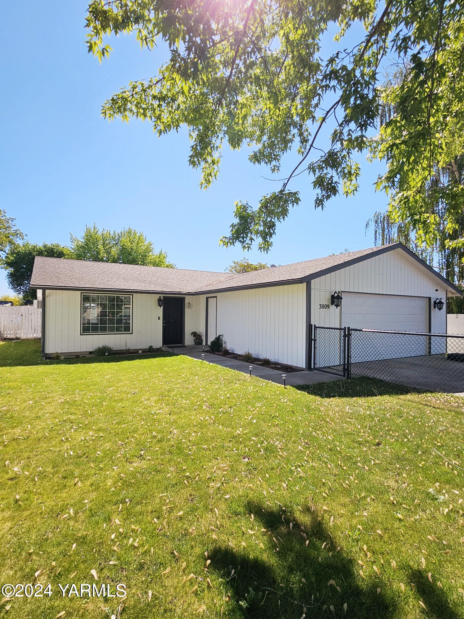 a front view of house with a yard