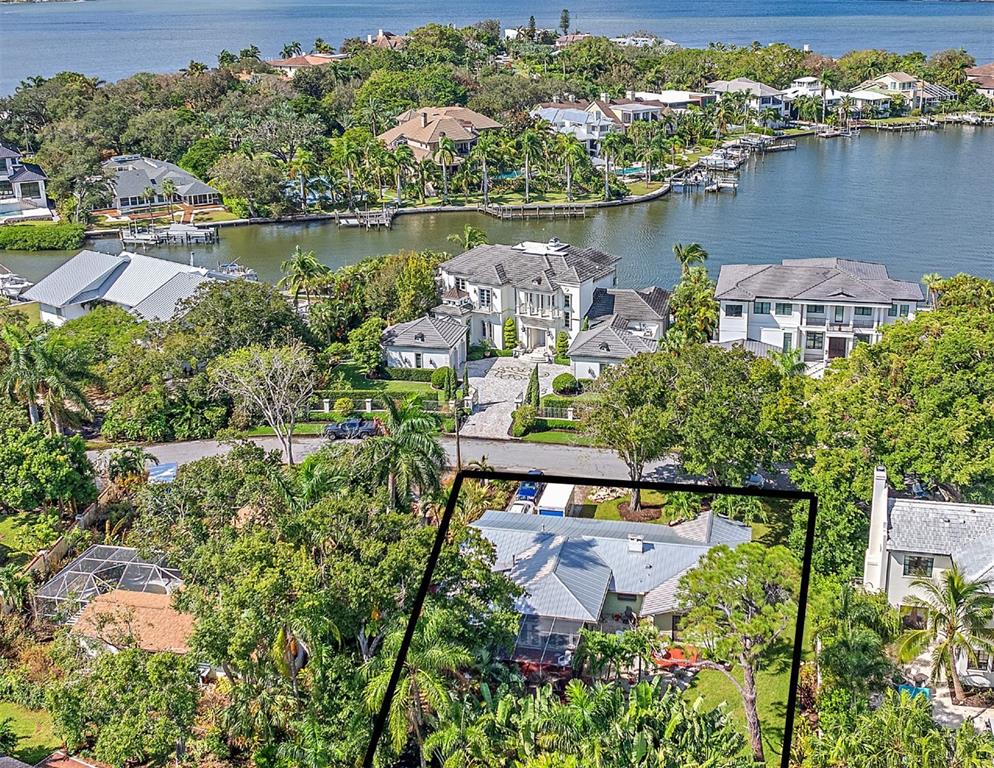 an aerial view of a house with a lake view