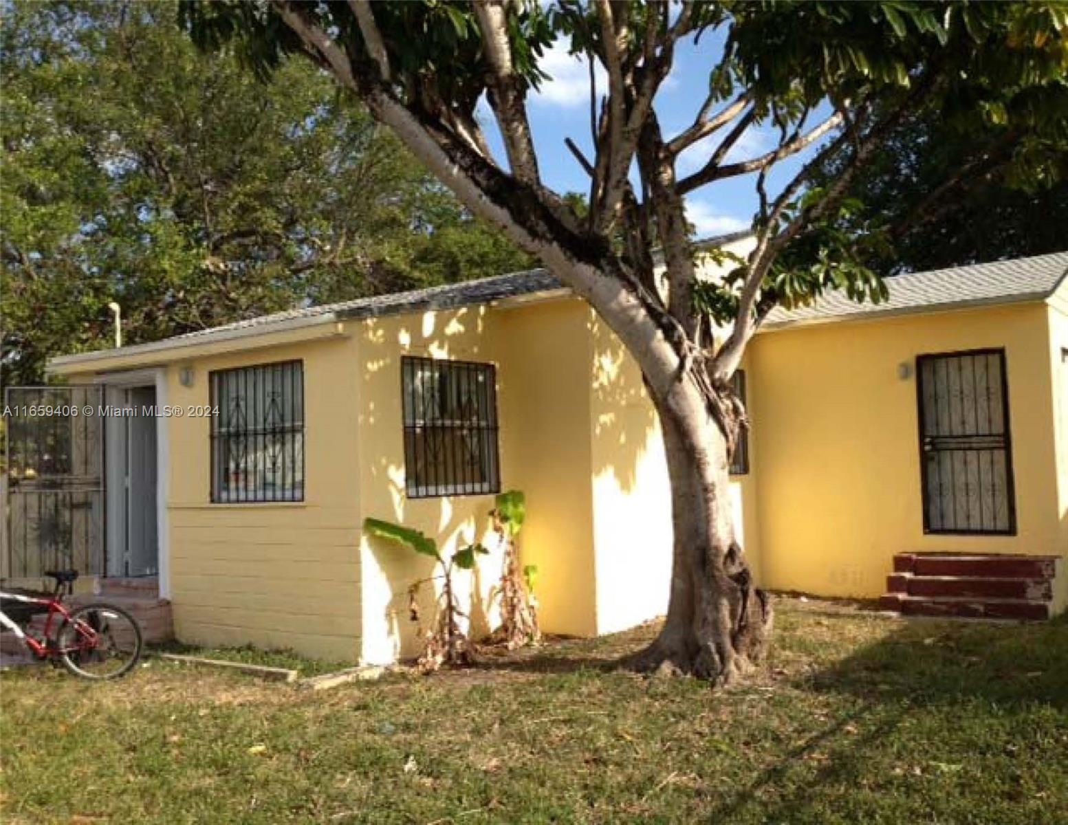 a view of a backyard of the house