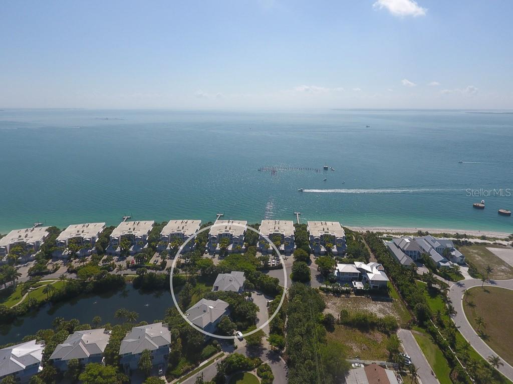 an aerial view of a house with a lake view