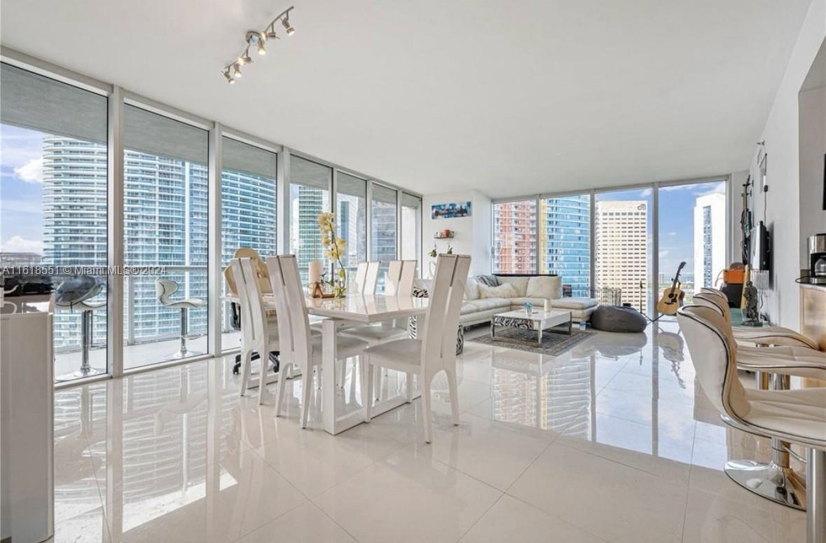 a view of a dining room with furniture window and outside view