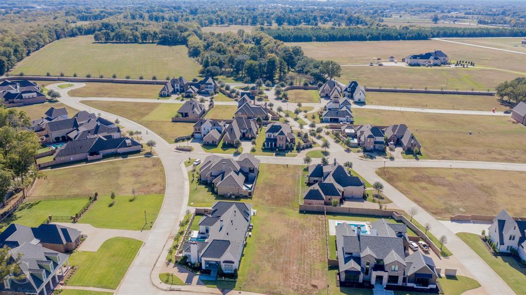 an aerial view of a house with outdoor space