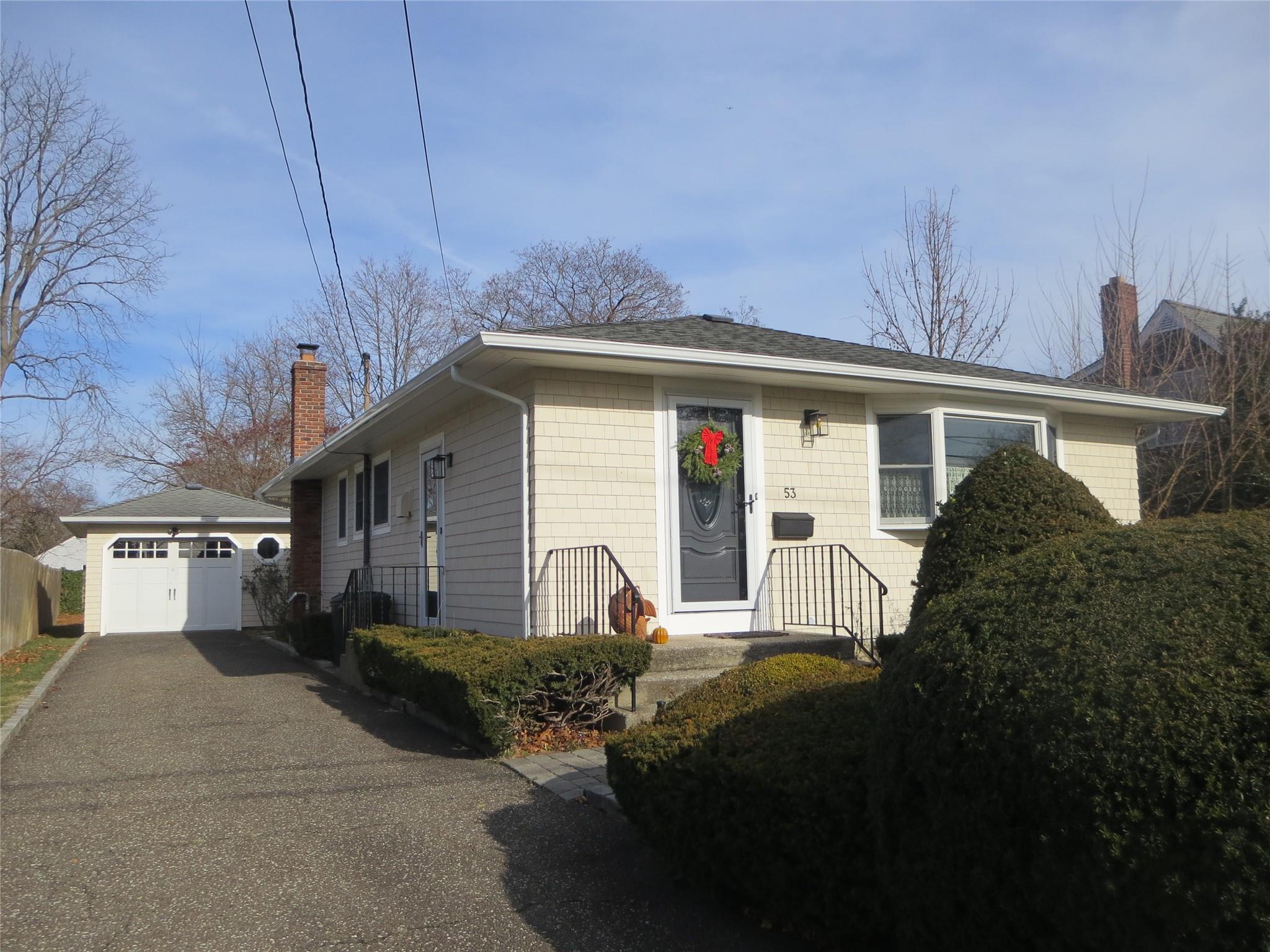 Single story home with a detached garage