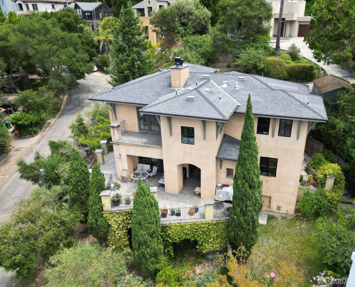 an aerial view of a house with yard