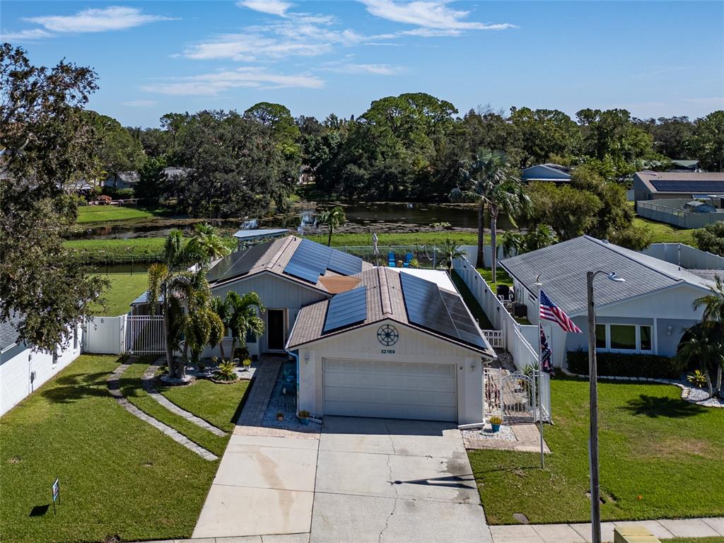 a aerial view of a house with a yard