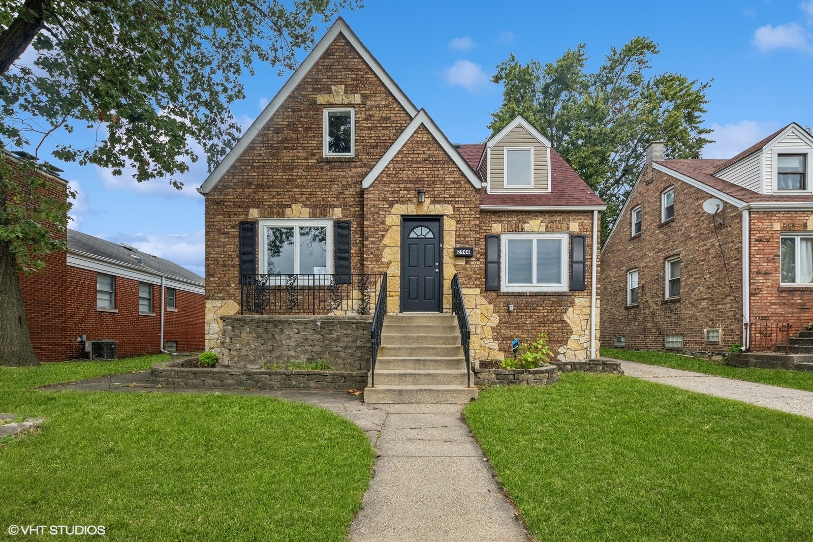 a front view of a house with garden