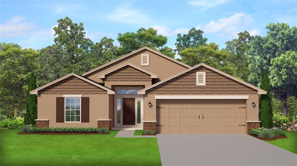 a front view of a house with a yard and trees