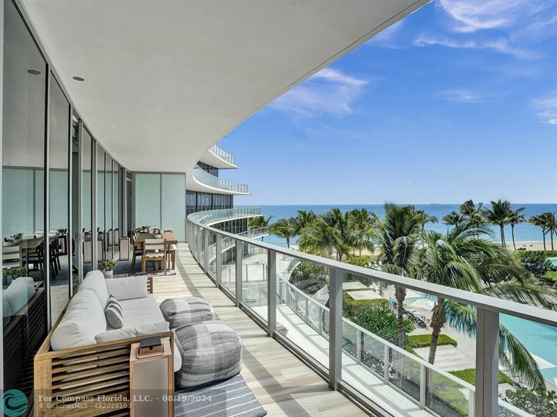 a view of balcony with furniture