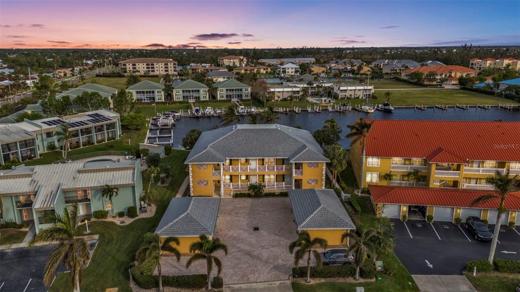 an aerial view of a house with a lake view