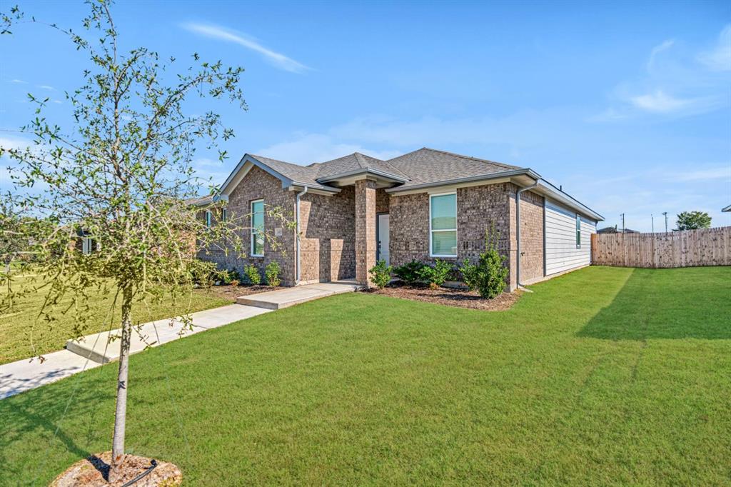 a front view of a house with a yard