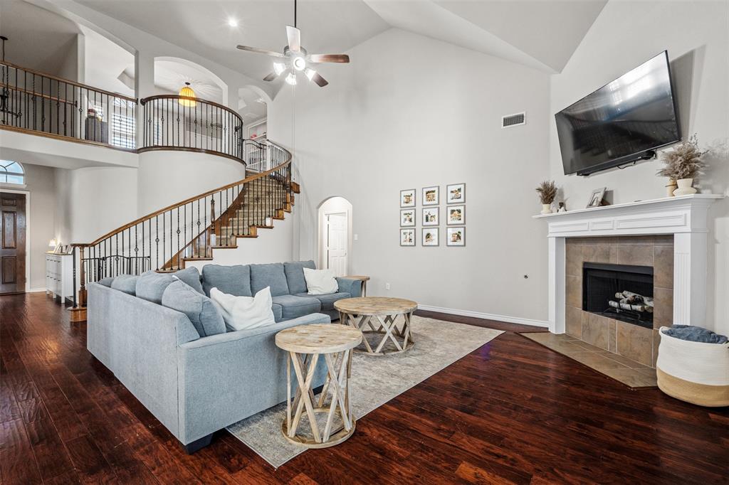 a living room with furniture fireplace and flat screen tv