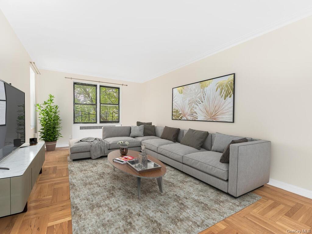 Living room with light parquet floors and crown molding