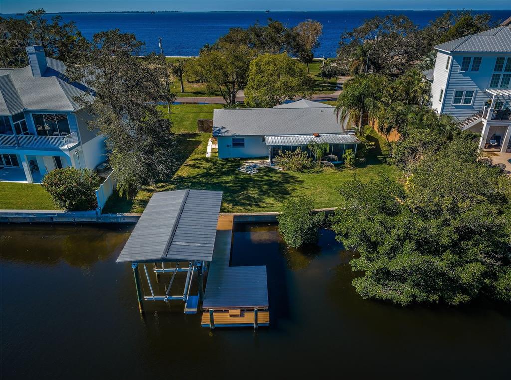 an aerial view of house with yard swimming pool and outdoor seating