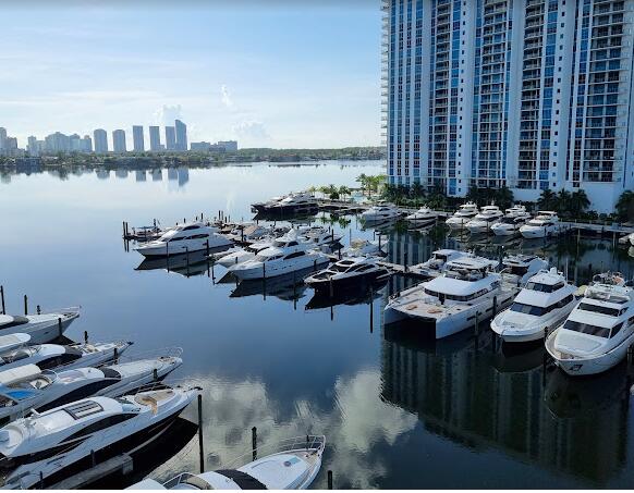 a view of a lake with couches chairs and a table