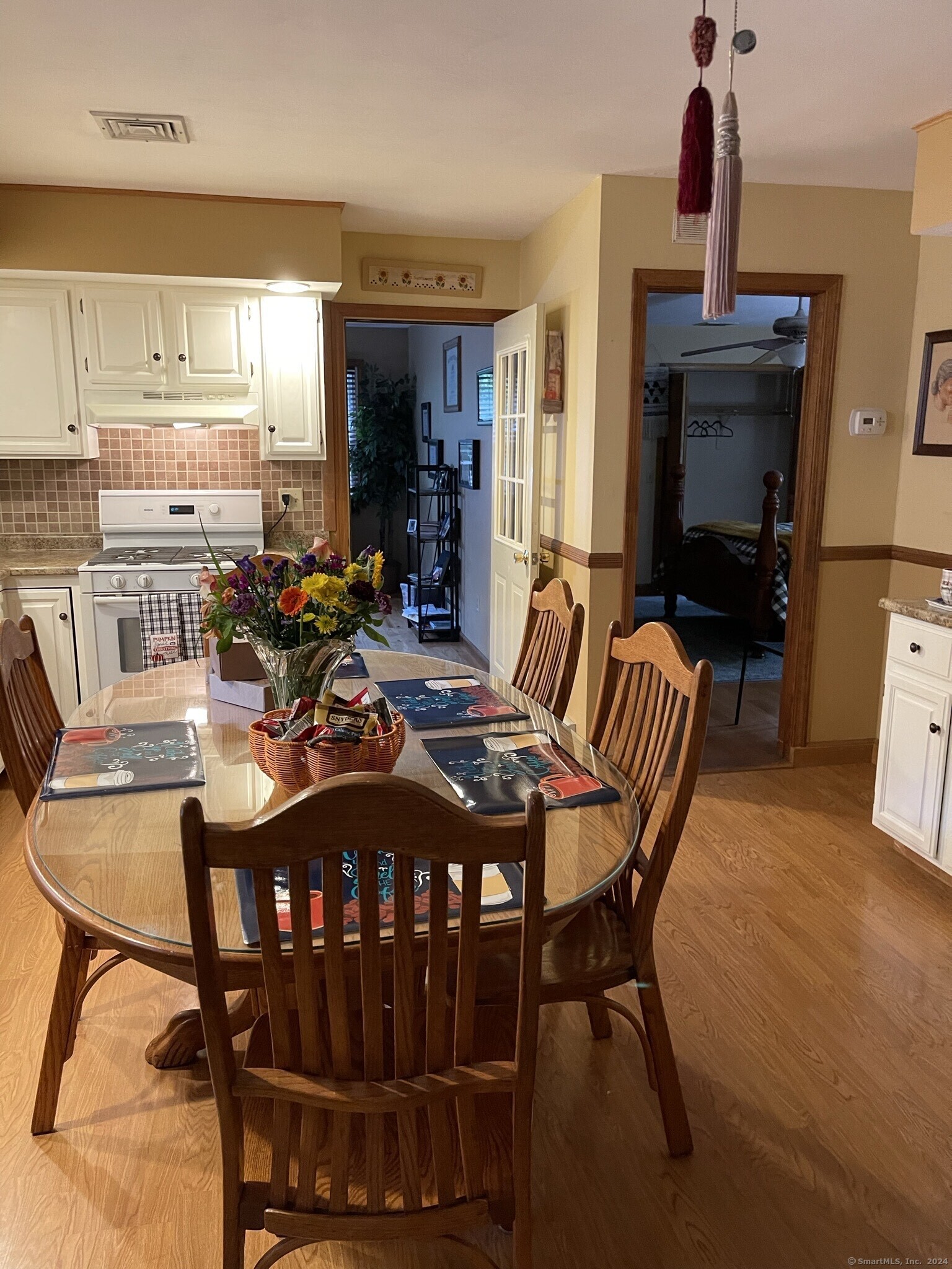 a view of a dining room with furniture and window