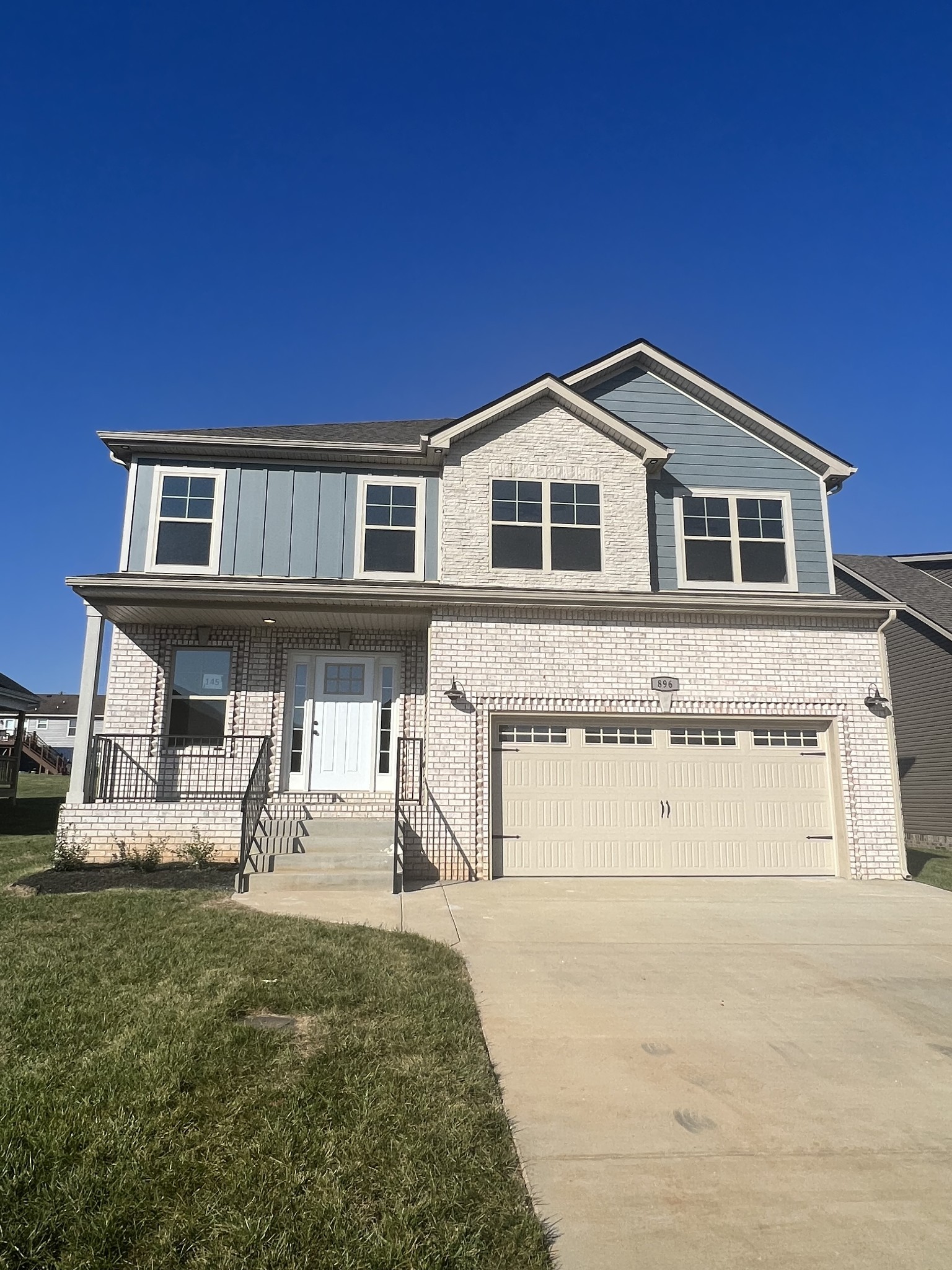 a front view of a house with garage