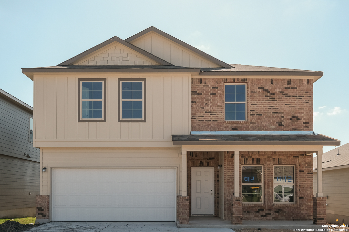 a front view of a house with yard