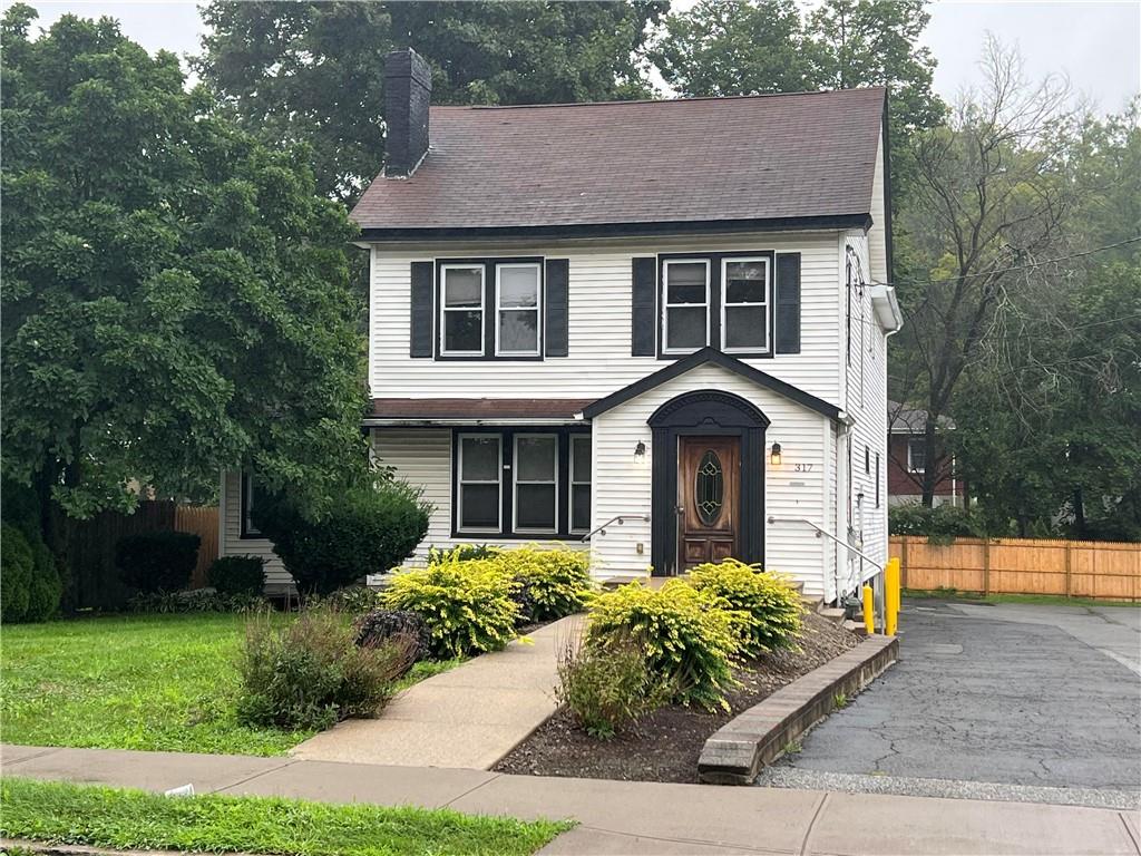 View of front of house with a front yard