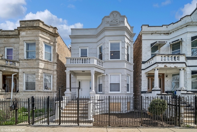 a front view of a residential apartment building with a door