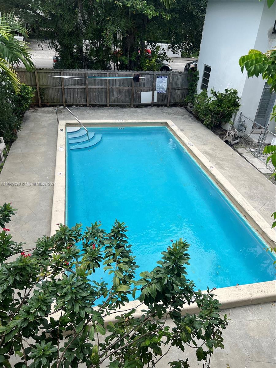 a view of a swimming pool with a patio